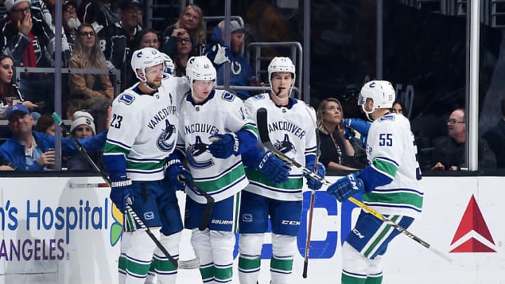 LOS ANGELES, CA - NOVEMBER 24: Alexander Edler #23, Elias Pettersson #40, Nikolay Goldobin #77 and Alex Biega #55 of the Vancouver Canucks celebrate Pettersson's third-period goal during the game against the Los Angeles Kings at STAPLES Center on November 24, 2018 in Los Angeles, California. (Photo by Adam Pantozzi/NHLI via Getty Images)