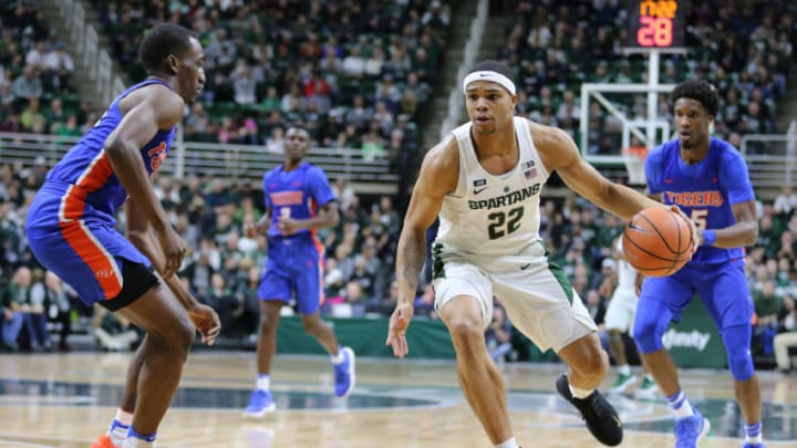 EAST LANSING, MI - DECEMBER 31: Miles Bridges #22 of the Michigan State Spartans handles the ball defended by Dexter McClanahan #22 of the Savannah State Tigers at Breslin Center on December 31, 2017 in East Lansing, Michigan. (Photo by Rey Del Rio/Getty Images)