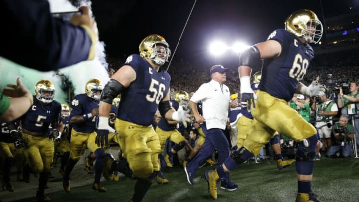 SOUTH BEND, IN - OCTOBER 21: Head coach Brian Kelly and the Notre Dame Fighting Irish take the field before a game against the USC Trojans at Notre Dame Stadium on October 21, 2017 in South Bend, Indiana. Notre Dame won 49-14. (Photo by Joe Robbins/Getty Images)