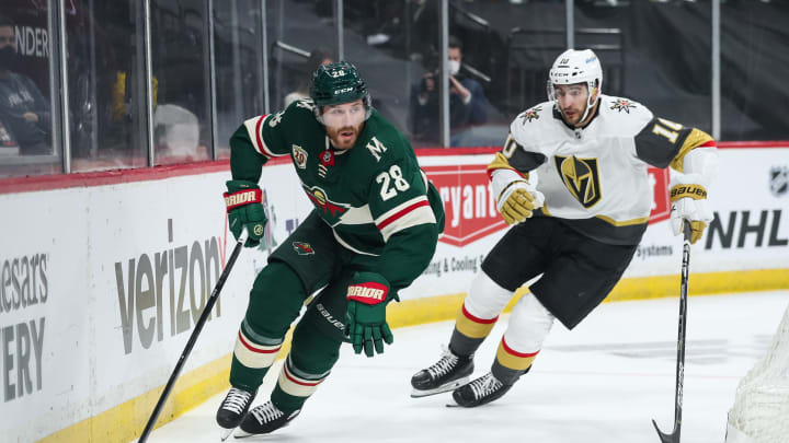 ST. PAUL, MN – MAY 22: Ian Cole #28 of the Minnesota Wild skates with the puck past Nicolas Roy #10 of the Vegas Golden Knights in the first period in Game Four of the First Round of the 2021 Stanley Cup Playoffs at Xcel Energy Center on May 22, 2021 in St Paul, Minnesota. The Golden Knights defeated the Wild 4-0. (Photo by David Berding/Getty Images)