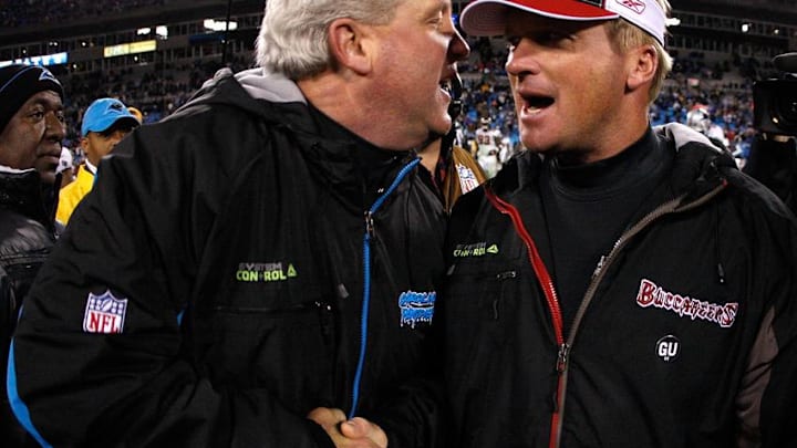 CHARLOTTE, NC - DECEMBER 08: Head coach Jon Gruden (R) of the Tampa Bay Buccaneers shakes hands with head coach John Fox (L) of the Carolina Panthers after the game at Bank of America Stadium on December 8, 2008 in Charlotte, North Carolina. (Photo by Streeter Lecka/Getty Images)