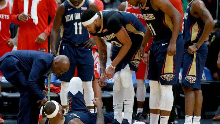 NEW ORLEANS, LA – JANUARY 26.DeMarcus Cousins #0 of the New Orleans Pelicans lies down on the ground after injuring his ankle. During the second half vs.  Houston Rockets  on January 26, 2018 in New Orleans, Louisiana.  (Photo by Sean Gardner/Getty Images)