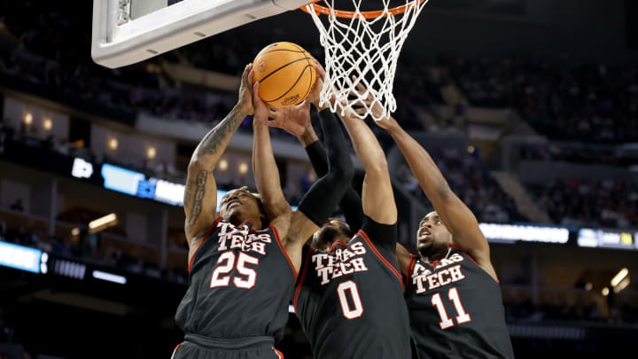 SAN FRANCISCO, CALIFORNIA – MARCH 24: Adonis Arms #25, Kevin Obanor #0, and Bryson Williams #11 of the Texas Tech Red Raiders fight for a rebound against the Duke Blue Devils during the first half in the Sweet Sixteen round game of the 2022 NCAA Men’s Basketball Tournament at Chase Center on March 24, 2022 in San Francisco, California. (Photo by Steph Chambers/Getty Images)