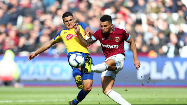 LONDON, ENGLAND - MAY 04: Ryan Fredericks of West Ham United battles for possession with Mohamed Elyounoussi of Southampton during the Premier League match between West Ham United and Southampton FC at London Stadium on May 04, 2019 in London, United Kingdom. (Photo by Dan Istitene/Getty Images)