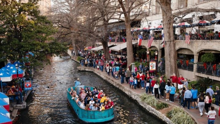 Football fans swarm the River Walk on Thursday, Dec. 27, 2018, in San Antonio.1227 Alamobusch 17 Jpg