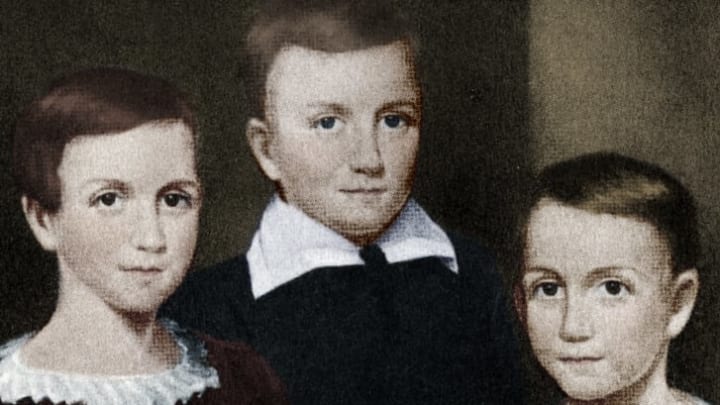 Left to right: Emily, Austin, and Lavinia Dickinson.