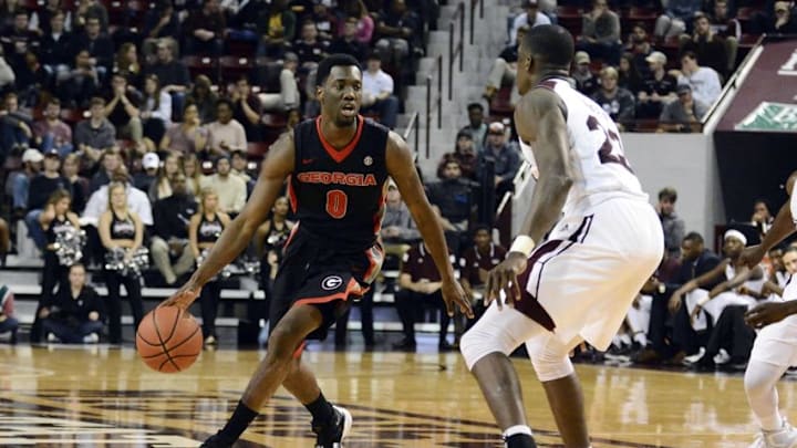 Feb 13, 2016; Starkville, MS, USA; Georgia Bulldogs guard William Jackson II (0) dribbles against Mississippi State Bulldogs guard Travis Daniels (23) during the second half of the game at Humphrey Coliseum. Georgia won 66 - 57. Mandatory Credit: Matt Bush-USA TODAY Sports