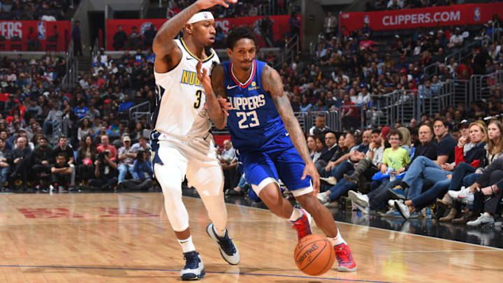 LOS ANGELES, CA - APRIL 7: Lou Williams #23 of the LA Clippers handles the ball against Torrey Craig #3 of the Denver Nuggets on April 7, 2018 at STAPLES Center in Los Angeles, California. NOTE TO USER: User expressly acknowledges and agrees that, by downloading and/or using this Photograph, user is consenting to the terms and conditions of the Getty Images License Agreement. Mandatory Copyright Notice: Copyright 2018 NBAE (Photo by Andrew D. Bernstein/NBAE via Getty Images)