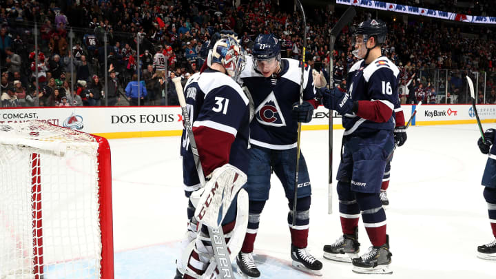 DENVER, COLORADO – NOVEMBER 30: Ryan Graves #27 of the Colorado Avalanche congratulates teammate goaltender Philipp Grubauer #31 after a win against the Chicago Blackhawks at Pepsi Center on November 30, 2019 in Denver, Colorado. The Avalanche defeated the Blackhawks 7-3. (Photo by Michael Martin/NHLI via Getty Images)