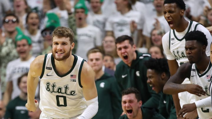 EAST LANSING, MICHIGAN – JANUARY 05: Kyle Ahrens #0 of the Michigan State Spartans reacts with teammates after a three point basket against the Michigan Wolverines during the second half at the Breslin Center on January 05, 2020 in East Lansing, Michigan. Michigan State won the game 87-69. (Photo by Gregory Shamus/Getty Images)