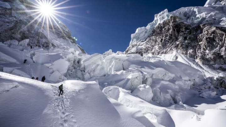 Climbers ascend the Khumbu Icefall, a notoriously dangerous section of the summit route.