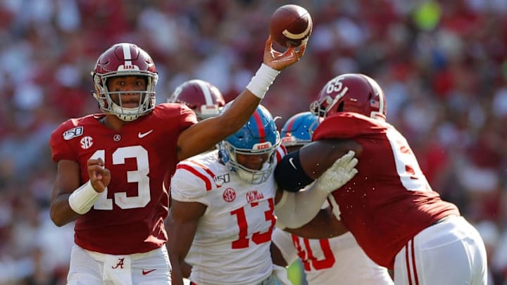 TUSCALOOSA, ALABAMA - SEPTEMBER 28: Tua Tagovailoa #13 of the Alabama Crimson Tide escapes the pocket as he looks to pass against the Mississippi Rebels at Bryant-Denny Stadium on September 28, 2019 in Tuscaloosa, Alabama. (Photo by Kevin C. Cox/Getty Images)