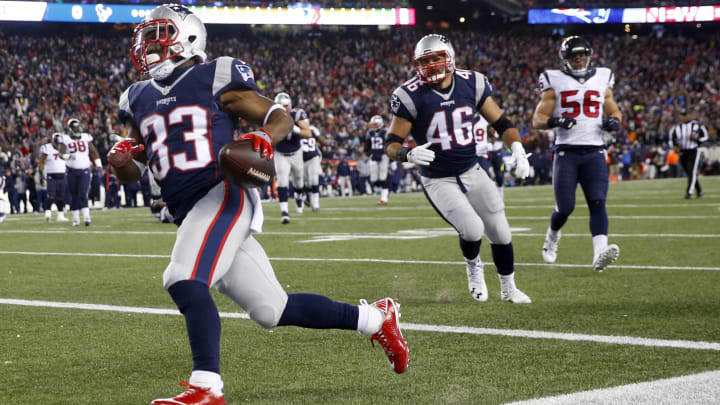 Jan 14, 2017; Foxborough, MA, USA; New England Patriots running back Dion Lewis (33) scores a touchdown against the Houston Texans during the first half in the AFC Divisional playoff game at Gillette Stadium. Mandatory Credit: Winslow Townson-USA TODAY Sports