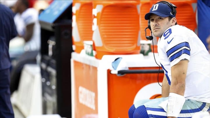 Dec 22, 2013; Landover, MD, USA; Dallas Cowboys quarterback Tony Romo (9) watches from the bench against the Washington Redskins in the fourth quarter at FedEx Field. The Cowboys won 24-23. Mandatory Credit: Geoff Burke-USA TODAY Sports