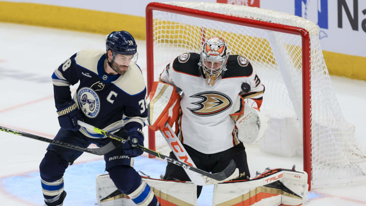 Jan 19, 2023; Columbus, Ohio, USA; Columbus Blue Jackets center Boone Jenner (38) deflects the puck against Anaheim Ducks goaltender John Gibson (36) in the third period at Nationwide Arena. Mandatory Credit: Aaron Doster-USA TODAY Sports