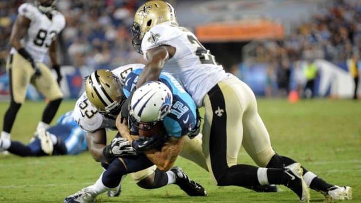Aug 30, 2012; Nashville, TN, USA; New Orleans Saints linebacker Ramon Humber (53) tackles Tennessee Titans wide receiver D.J. Woods (12) during the second half of a preseason game at LP Field. Tennessee won 10 to 6. Mandatory Credit: Randy Sartin-USA TODAY Sports