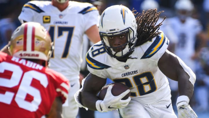 CARSON, CA - SEPTEMBER 30: Running back Melvin Gordon #28 of the Los Angeles Chargers runs the ball by cornerback Greg Mabin #26 of the San Francisco 49ers at StubHub Center on September 30, 2018 in Carson, California. (Photo by Jayne Kamin-Oncea/Getty Images)