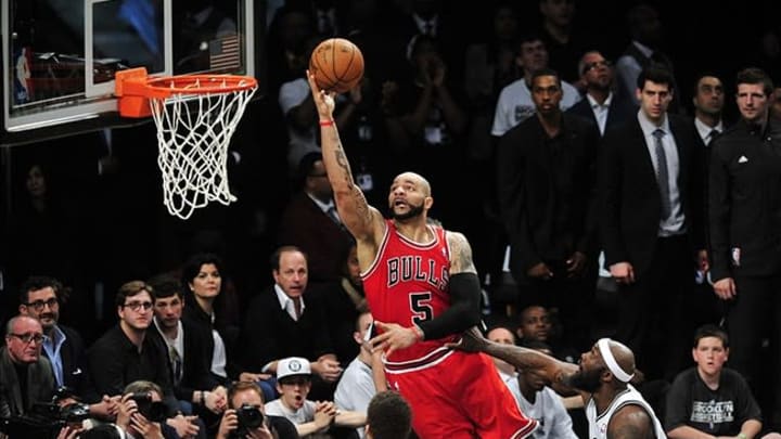 May 4, 2013; Brooklyn, NY, USA; Chicago Bulls power forward Carlos Boozer (5) puts up a layup against the Brooklyn Nets during the second half in game seven of the first round of the 2013 NBA Playoffs at the Barclays Center. The Bulls won 99-93. Mandatory Credit: Joe Camporeale-USA TODAY Sports