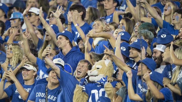 PROVO, UT- SEPTEMBER 10: Members of the Brigham Young Cougars student section take a photo with the team’s mascot Cosmo during the first half of their game against the Baylor Bears September 10, 2022 at LaVell Edwards Stadium in Provo, Utah. (Photo by Chris Gardner/Getty Images)