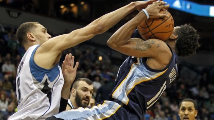 Jan 23, 2016; Minneapolis, MN, USA; Minnesota Timberwolves guard Zach LaVine (8) blocks the shot attempt of Memphis Grizzlies guard Mike Conley (11) in the second quarter at Target Center. Mandatory Credit: Bruce Kluckhohn-USA TODAY Sports