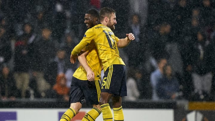 GUIMARAES, PORTUGAL - NOVEMBER 06: Shkodran Mustafi of Arsenal FC celebrates with Ainsley Maitland-Niles after scoring his team's first goal during the UEFA Europa League group F match between Vitoria Guimaraes and Arsenal FC at Estadio Dom Afonso Henriques on November 06, 2019 in Guimaraes, Portugal. (Photo by Quality Sport Images/Getty Images)