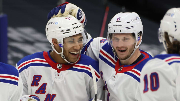 K’Andre Miller #79 of the New York Rangers (L) celebrates his third period goal against the New York Islanders and is joined by Jacob Trouba #8 (R) . (Photo by Bruce Bennett/Getty Images)