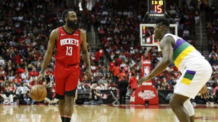 HOUSTON, TEXAS - FEBRUARY 02: James Harden #13 of the Houston Rockets dribbles the ball defended by Zion Williamson #1 of the New Orleans Pelicans(Photo by Tim Warner/Getty Images)