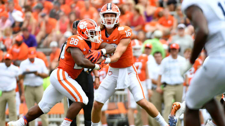 CLEMSON, SC - SEPTEMBER 15: Quarterback Trevor Lawrence #16 hands off to running back Adam Choice #26 of the Clemson Tigers during the Tigers' football game against the Georgia Southern Eagles at Clemson Memorial Stadium on September 15, 2018 in Clemson, South Carolina. (Photo by Mike Comer/Getty Images)