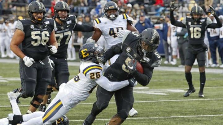NASHVILLE, TENNESSEE - NOVEMBER 23: Running back Ke'Shawn Vaughn #5 of the Vanderbilt Commodores rushes against the East Tennessee State Buccaneers during the first half at Vanderbilt Stadium on November 23, 2019 in Nashville, Tennessee. (Photo by Frederick Breedon/Getty Images)