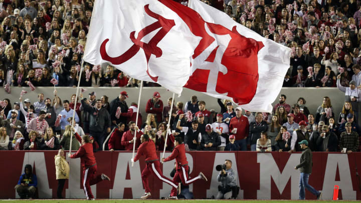 Nov 24, 2018; Tuscaloosa, AL, USA; Alabama Crimson Tide flags are ran across the end zone against the Auburn Tigers during the second half at Bryant-Denny Stadium. Mandatory Credit: Marvin Gentry-USA TODAY Sports