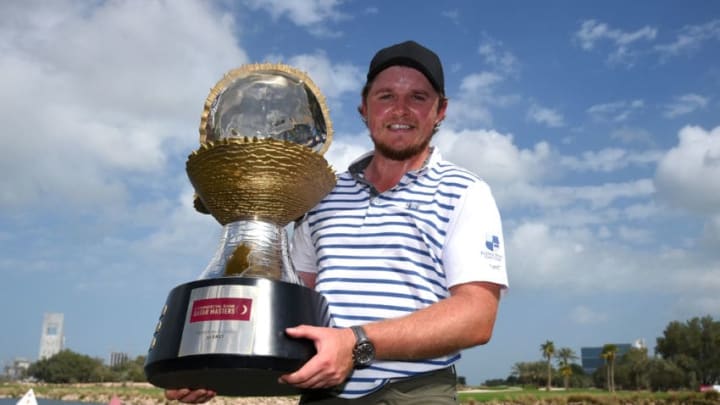DOHA, QATAR - FEBRUARY 25: Eddie Pepperell of England poses with the trophy following his victory during the final round of the Commercial Bank Qatar Masters at Doha Golf Club on February 25, 2018 in Doha, Qatar. (Photo by Tom Dulat/Getty Images)