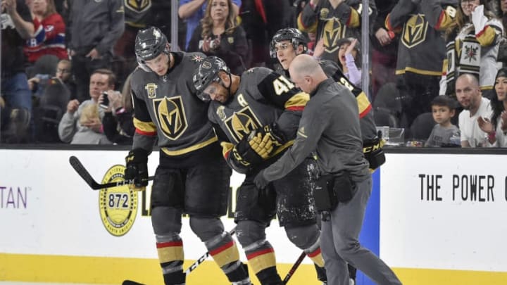 LAS VEGAS, NV - FEBRUARY 17: Pierre-Edouard Bellemare #41 is helped off the ice by his teammates Brayden McNabb #3 and Tomas Nosek #92 of the Vegas Golden Knights after being injured during the game against the Montreal Canadiens at T-Mobile Arena on February 17, 2018 in Las Vegas, Nevada. (Photo by Jeff Bottari/NHLI via Getty Images)