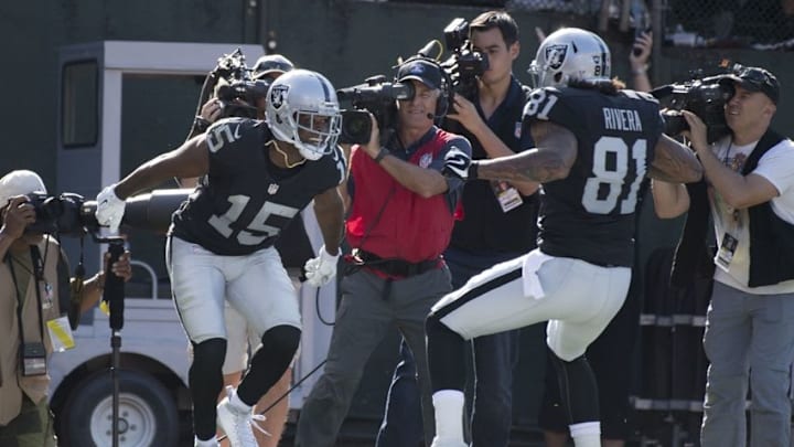October 9, 2016; Oakland, CA, USA; Oakland Raiders wide receiver Michael Crabtree (15) is congratulated by tight end Mychal Rivera (81) after scoring touchdown against the San Diego Chargers during the third quarter at Oakland Coliseum. Mandatory Credit: Kyle Terada-USA TODAY Sports