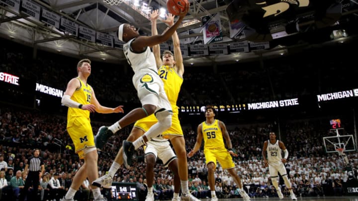EAST LANSING, MICHIGAN - JANUARY 05: Cassius Winston #5 of the Michigan State Spartans gets to the basket past Franz Wagner #21 of the Michigan Wolverines during the first half at Breslin Center on January 05, 2020 in East Lansing, Michigan. (Photo by Gregory Shamus/Getty Images)