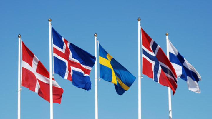 Photo of the Scandinavian flags against a blue sky