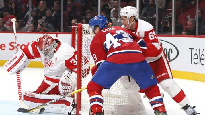 Nov 12, 2016; Montreal, Quebec, CAN; Detroit Red Wings goalie Petr Mrazek (34) makes a save against Montreal Canadiens left wing Daniel Carr (43) as defenseman Danny DeKeyser (65) defend during the third period at Bell Centre. Mandatory Credit: Jean-Yves Ahern-USA TODAY Sports