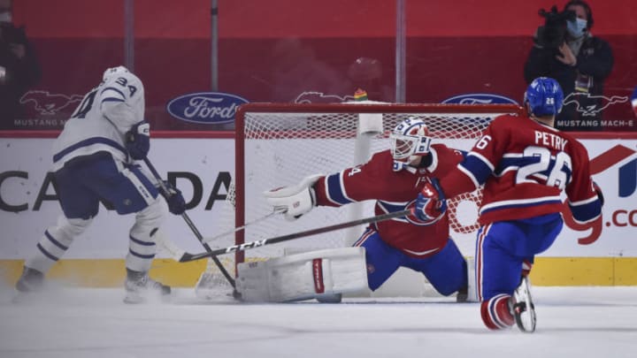 MONTREAL, QC - MAY 03: Goaltender Jake Allen #34 of the Montreal Canadiens stretches out the right pad to make a save on Auston Matthews #34 of the Toronto Maple Leafs in overtime at the Bell Centre on May 3, 2021 in Montreal, Canada. The Montreal Canadiens defeated the Toronto Maple Leafs 3-2 in overtime. (Photo by Minas Panagiotakis/Getty Images)