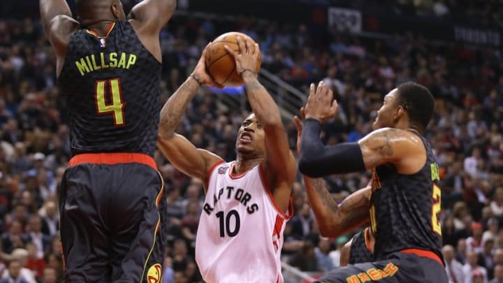 Mar 10, 2016; Toronto, Ontario, CAN; Toronto Raptors guard DeMar DeRozan (10) goes up to the basket against Atlanta Hawks forward Paul Millsap (4) at Air Canada Centre. Mandatory Credit: Tom Szczerbowski-USA TODAY Sports