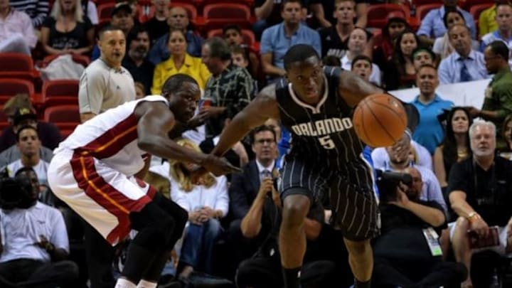 Apr 13, 2015; Miami, FL, USA; Orlando Magic guard Victor Oladipo (5) on a break away from Miami Heat forward Luol Deng (9) during the first half at American Airlines Arena. Mandatory Credit: Steve Mitchell-USA TODAY Sports Apr 13, 2015; Miami, FL, USA; Orlando Magic guard Victor Oladipo (5) on a break away from Miami Heat forward Luol Deng (9) during the first half at American Airlines Arena. Mandatory Credit: Steve Mitchell-USA TODAY Sports