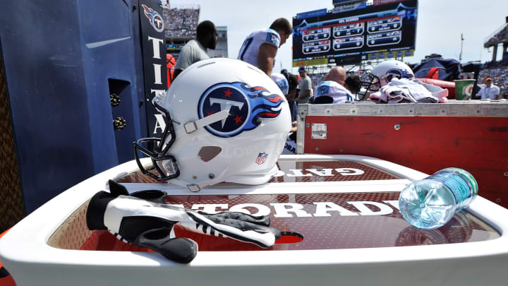 NASHVILLE, TN – SEPTEMBER 14: A Titans helmets rests on a Gatorade cooler on the sideline during a game between the Tennessee Titans and the Dallas Cowboys at LP Field on September 14, 2014 in Nashville, Tennessee. (Photo by Frederick Breedon/Getty Images)