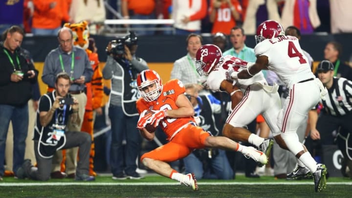 Jan 11, 2016; Glendale, AZ, USA; Clemson Tigers wide receiver Hunter Renfrow (13) catches a touchdown pass over Alabama Crimson Tide defensive back Eddie Jackson (4) and defensive back Minkah Fitzpatrick (29) in the first quarter in the 2016 CFP National Championship at University of Phoenix Stadium. Mandatory Credit: Mark J. Rebilas-USA TODAY Sports