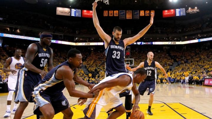 May 3, 2015; Oakland, CA, USA; Golden State Warriors forward Harrison Barnes (40) dribbles away from Memphis Grizzlies forward Tony Allen (9) as Marc Gasol (33) looks on during the third quarter in game one of the second round of the NBA Playoffs at Oracle Arena. The Warriors defeated the Grizzlies 101-86. Mandatory Credit: Cary Edmondson-USA TODAY Sports