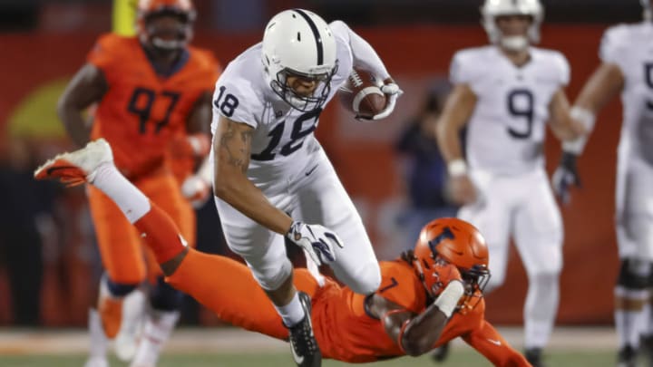 CHAMPAIGN, IL - SEPTEMBER 21: Jonathan Holland #18 of the Penn State Nittany Lions runs the ball after a reception as Stanley Green #7 of the Illinois Fighting Illini attempts the tackle from behind during the first quarter at Memorial Stadium on September 21, 2018 in Champaign, Illinois. (Photo by Michael Hickey/Getty Images)