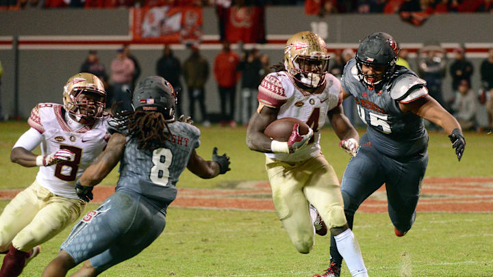 Nov 5, 2016; Raleigh, NC, USA; Florida State Seminoles running back Dalvin Cook (4) runs the ball during the second half against the North Carolina State Wolfpack at Carter Finley Stadium. Florida State won 24-20. Mandatory Credit: Rob Kinnan-USA TODAY Sports