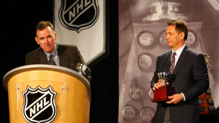 PITTSBURGH - MAY 28: Goaltending coach Jim Bedard of the Detroit Red Wings speaks alongside General Manager Ken Holland after accepting the William M. Jennings Trophy for Chris Osgood (not pictured) during the NHL Awards presentation at the Omni William Penn Hotel on May 28, 2008 in Pittsburgh, Pennsylvania. (Photo by Dave Sandford/Getty Images)