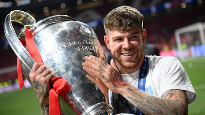 MADRID, SPAIN - JUNE 01: Alberto Moreno of Liverpool celebrates with the Champions League Trophy after winning the UEFA Champions League Final between Tottenham Hotspur and Liverpool at Estadio Wanda Metropolitano on June 01, 2019 in Madrid, Spain. (Photo by Matthias Hangst/Getty Images)
