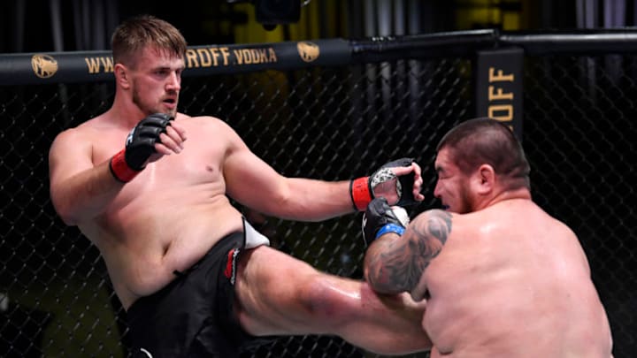 LAS VEGAS, NEVADA - SEPTEMBER 12: (L-R) Alexandr Romanov of Moldova kicks Roque Martinez of Guam in a heavyweight fight during the UFC Fight Night event at UFC APEX on September 12, 2020 in Las Vegas, Nevada. (Photo by Jeff Bottari/Zuffa LLC)