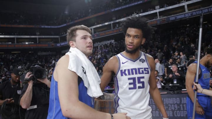 SACRAMENTO, CA - MARCH 21: Luka Doncic #77 of the Dallas Mavericks talks to Marvin Bagley III #35 of the Sacramento Kings on March 21, 2019 at Golden 1 Center in Sacramento, California. NOTE TO USER: User expressly acknowledges and agrees that, by downloading and or using this photograph, User is consenting to the terms and conditions of the Getty Images Agreement. Mandatory Copyright Notice: Copyright 2019 NBAE (Photo by Rocky Widner/NBAE via Getty Images)