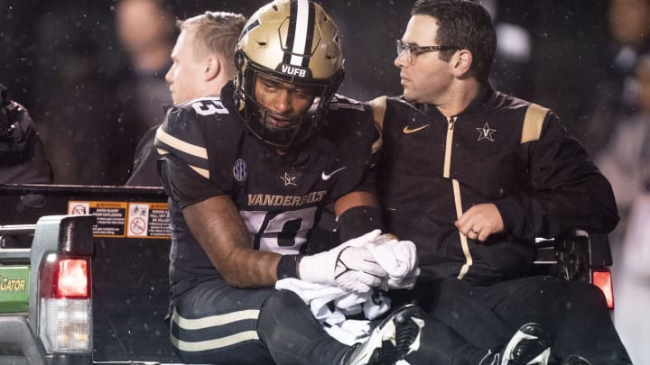 Nov 26, 2022; Nashville, Tennessee, USA;Vanderbilt Commodores linebacker CJ Taylor (13) is carted off the field after suffering an apparent injury during the third quarter against the Tennessee Volunteers at FirstBank Stadium. Mandatory Credit: George Walker IV – USA TODAY Sports