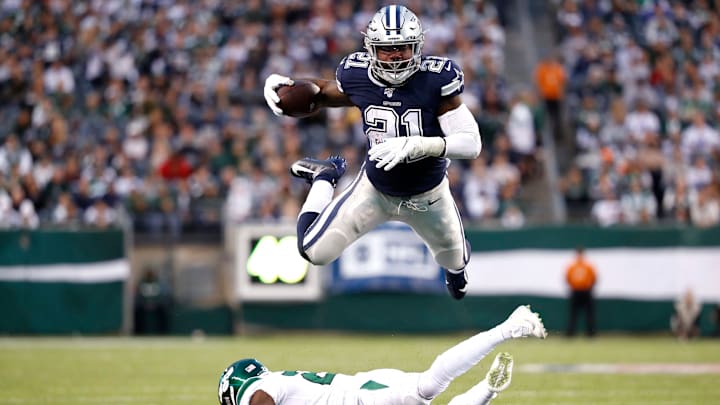 EAST RUTHERFORD, NEW JERSEY – OCTOBER 13: Ezekiel Elliott #21 of the Dallas Cowboys leaps over Marcus Maye #20 of the New York Jets in the third quarter at MetLife Stadium on October 13, 2019 in East Rutherford, New Jersey. The Jets defeated the Cowboys 24-22. (Photo by Michael Owens/Getty Images)